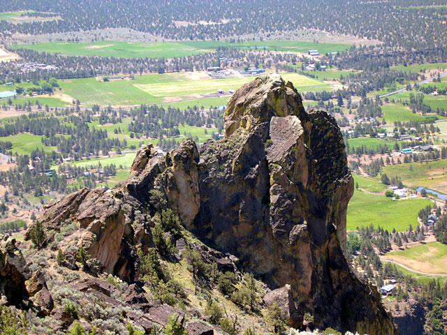 Craggy Smith Rock is surrounded by small ranches and farms