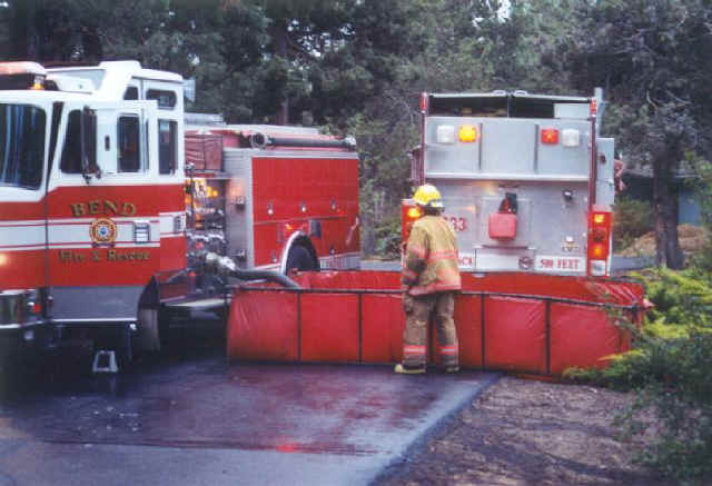 Fire trucks pumping water